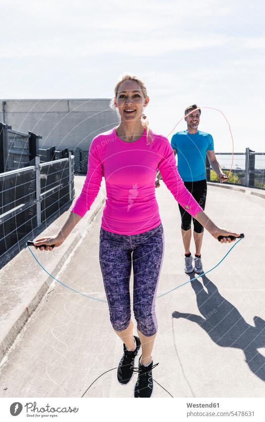 Man and woman skipping rope exercising exercise training practising jumping rope skip rope jump rope Jumping Ropes jump ropes jumpropes skipping ropes Leaping