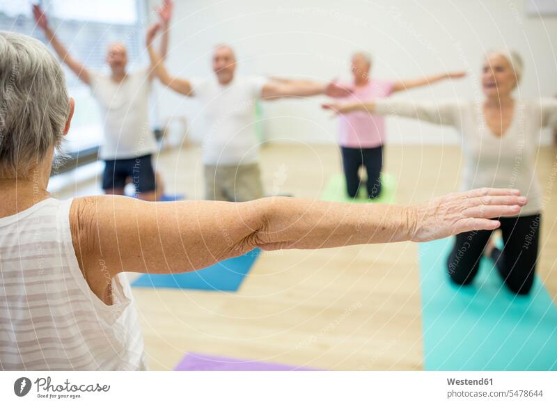 Group of active seniors practicing yoga together human human being human beings humans person persons caucasian appearance caucasian ethnicity european