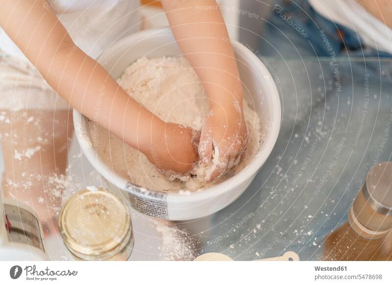 Close-up of girl making a cake mixing flour in a bowl Bowl Bowls baking bake kitchen domestic kitchen kitchens pies cakes Sweet Food sweet foods food and drink