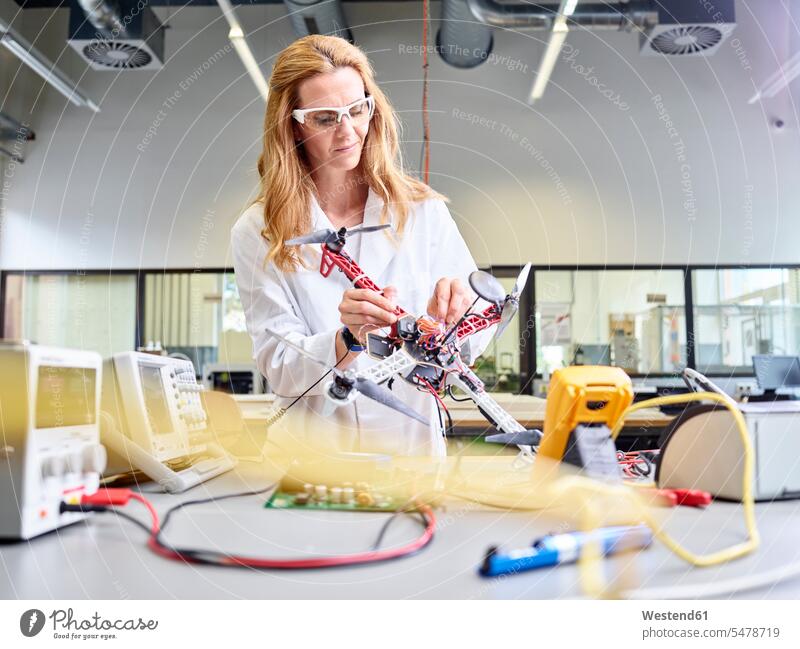 Female technician working in research laboratory, developing drone engineer female engineer engineers female engineers drones At Work female technician