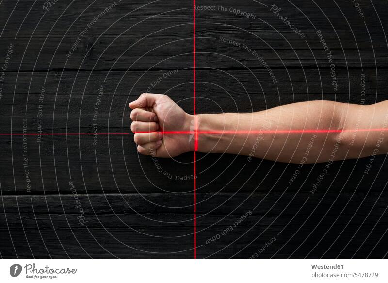 Human hand getting scanned by red light rays bird's eye view from above Birds-Eye Perspective top view Birds-Eye View overhead view reticle crosshair cross hair