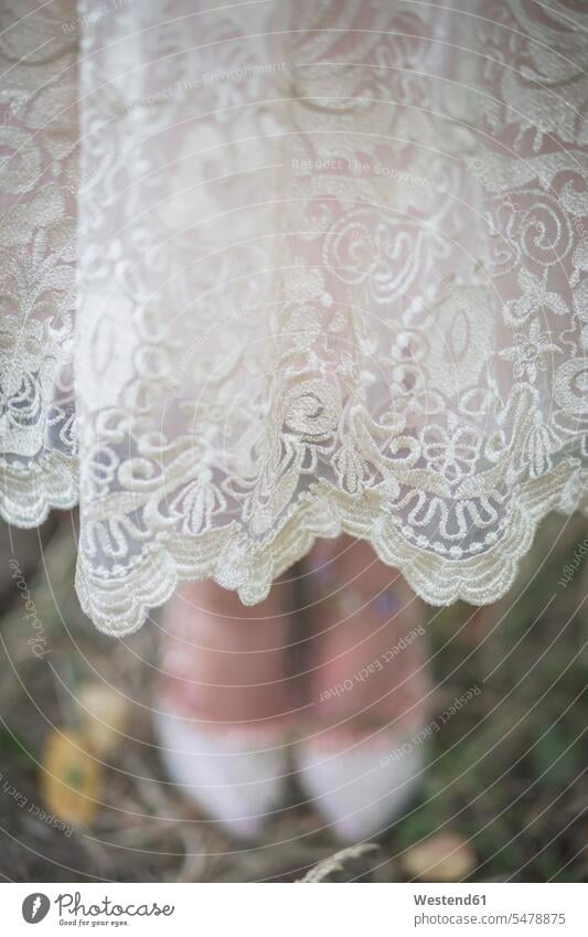 Close-up of bride wearing lace dress Lace lacey brides dresses Wedding getting married marrying Marriage wedding dress wedding dresses Bridal Gown Wedding Gown