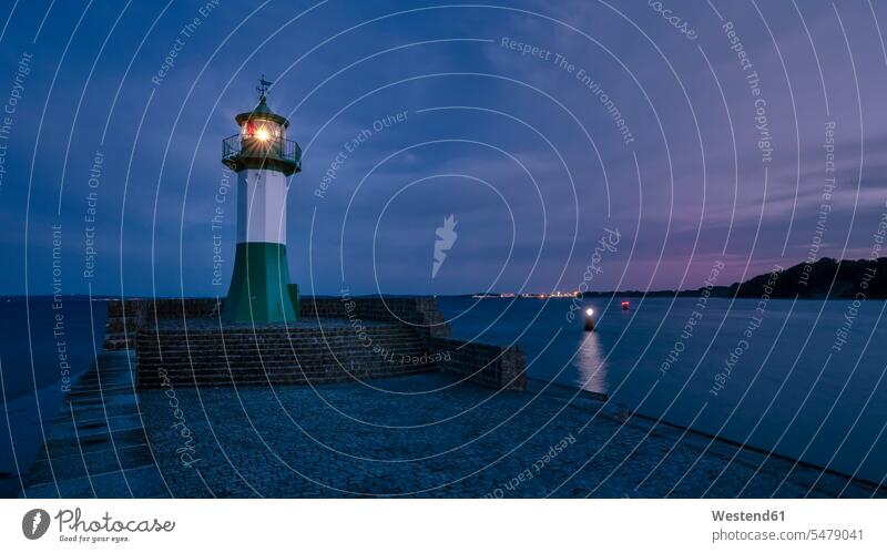 Germany, Mecklenburg-Western Pomerania, Sassnitz, Small lighthouse on shore of Rugen island at night outdoors location shots outdoor shot outdoor shots coast
