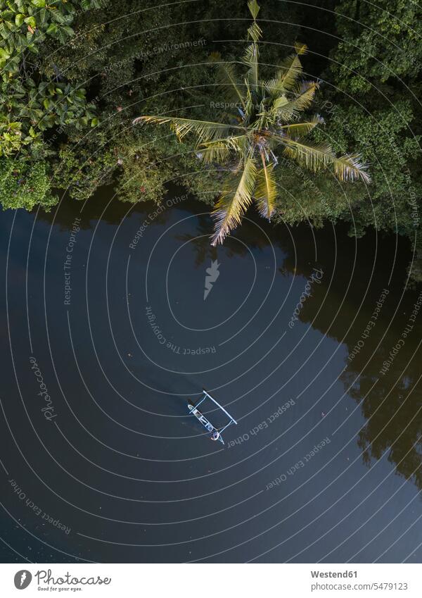 Drone shot of boat on river at Bali, Indonesia aerial view bird's eye view bird's eye views birds eye view birds eye views aerial photo aerial photos