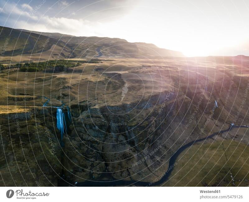 Iceland, Aerial view of waterfall splashing down high cliff at sunset Long Exposure Time Exposure Time Exposed long exposure photography long exposure shot