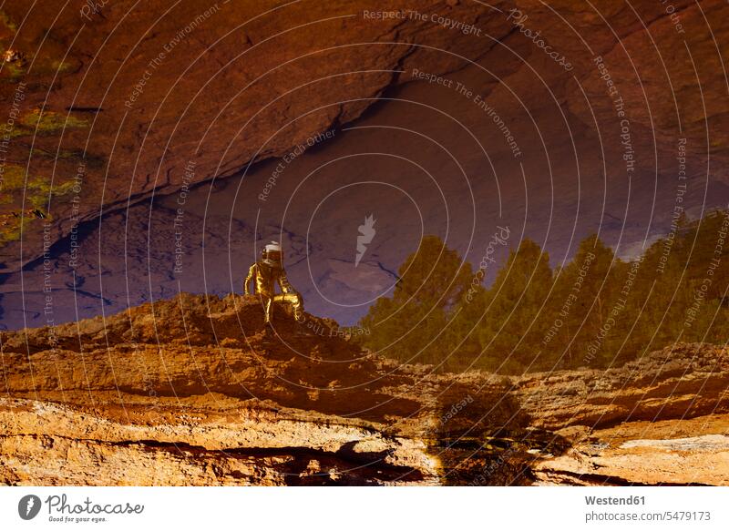 Astronaut exploring while sitting on moon color image colour image outdoors location shots outdoor shot outdoor shots full length full-length full body