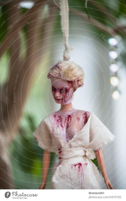 Hanged blood-smeared Barbie doll The End symbol symbolical symbolic photo Ending Horror messy blood stained bizarre spooky creepy crime crimes Violence brutal
