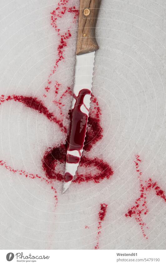 Germany, Close up of knife with blood in snowy winter Threat Menace menacing threaten mystery mysterious crime crimes knives Part Of partial view overhead view