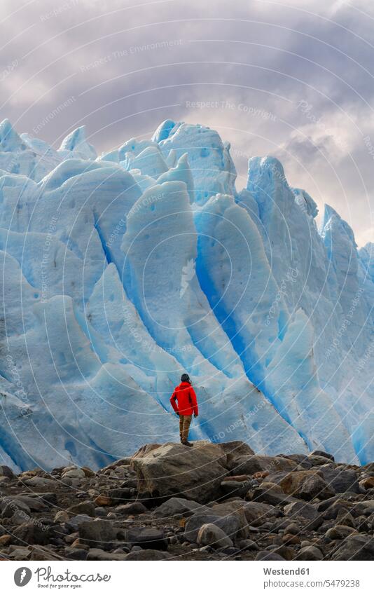 Man in front of Perito Moreno Glacier, El Calafate, Los Glaciares National Park, Patagonia, Argentina (value=0) touristic tourists stand experience Experiences