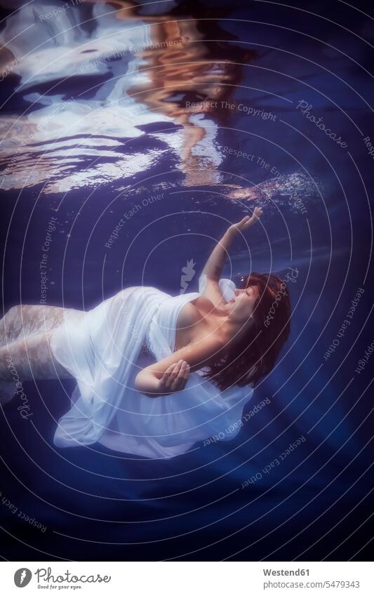 Pregnant woman wearing white dress under water dresses Wellbeing Well-Being Well Being swimming baby belly baby bump pregnant belly females women Pregnant Woman