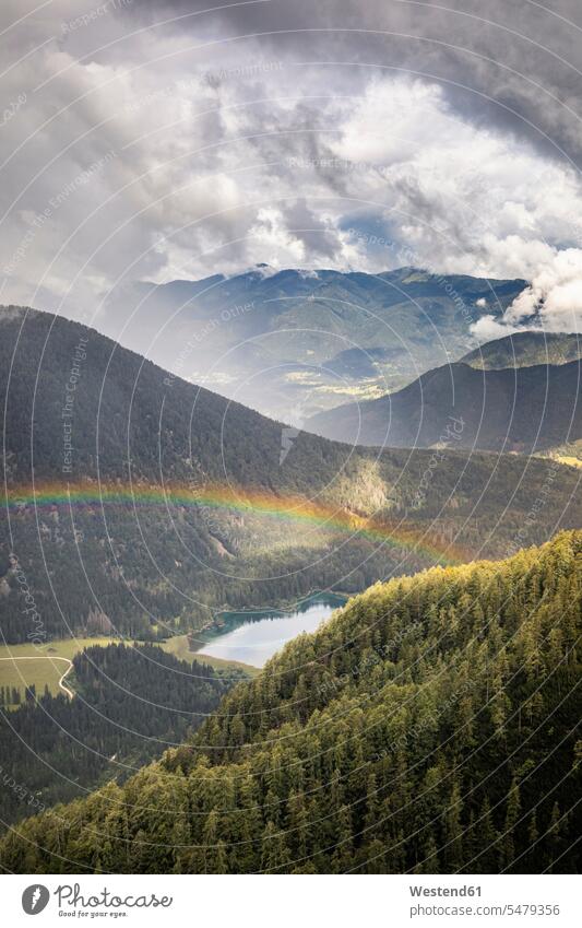 Rainbow over mountain landscape with lake outdoors location shots outdoor shot outdoor shots day daylight shot daylight shots day shots daytime landscapes