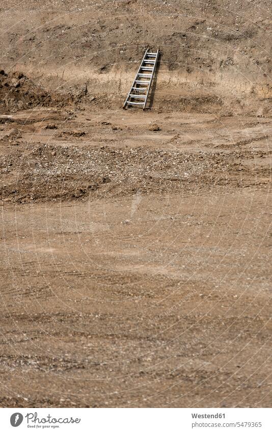 Ladder on land during sunny day Absence Absent color image colour image daylight shot daylight shots day shots daytime dirt dirtiness filth outdoors