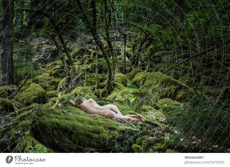 Naked young woman sleeping in forest females women moss asleep enchanted nude nudes woods forests lying laying down lie lying down young women Adults grown-ups