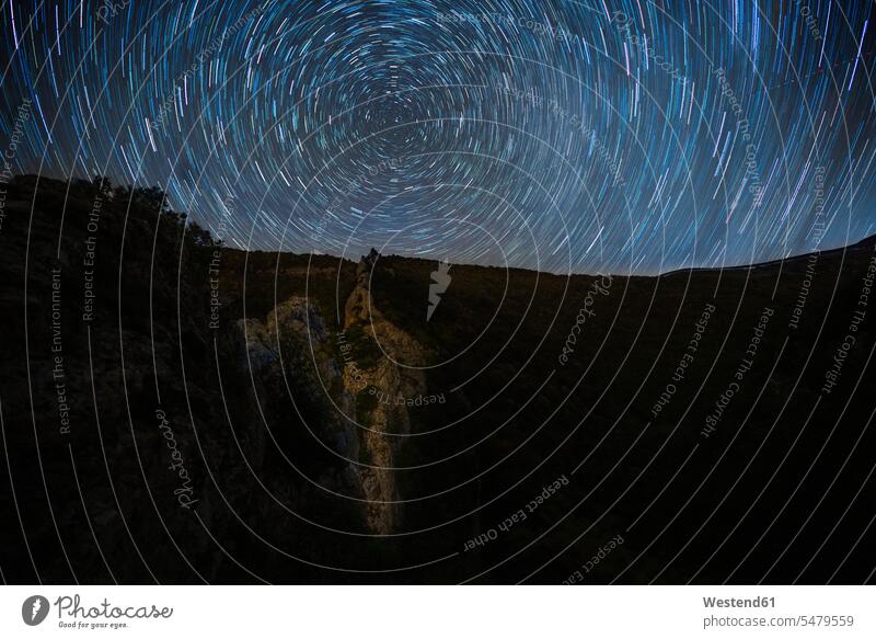 Italy, Star trails over Monte Cucco at night outdoors location shots outdoor shot outdoor shots low angle view worm's eye view worms eye from below