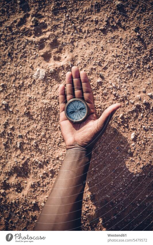 North Africa, Sahara desert, man' hand holding compass compasses navigational compass nature natural world Saharawi Saharawi people Western Sahara young man