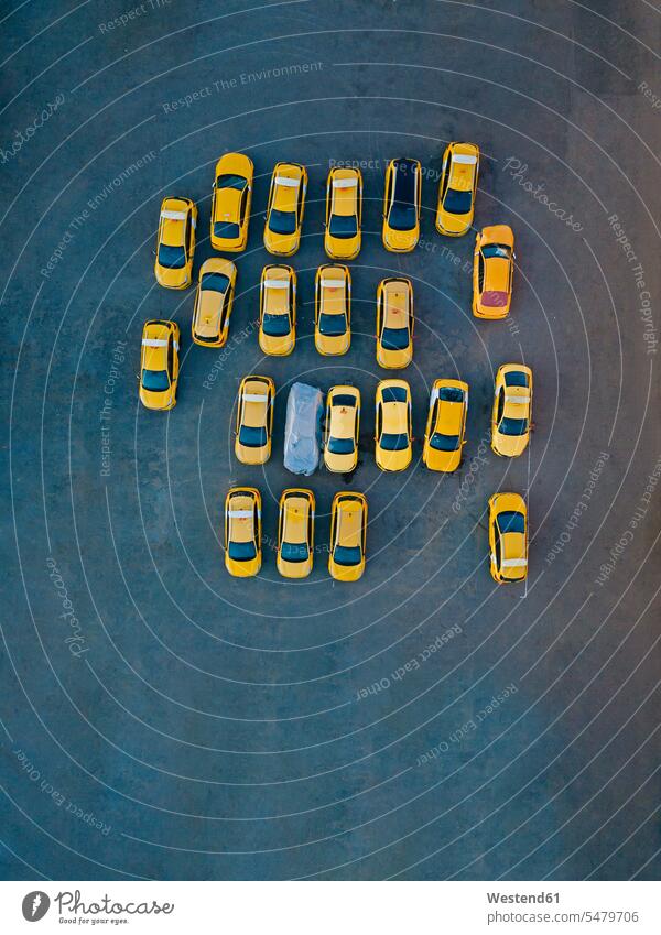 Aerial view of yellow cars parked in parking lot outdoors location shots outdoor shot outdoor shots day daylight shot daylight shots day shots daytime