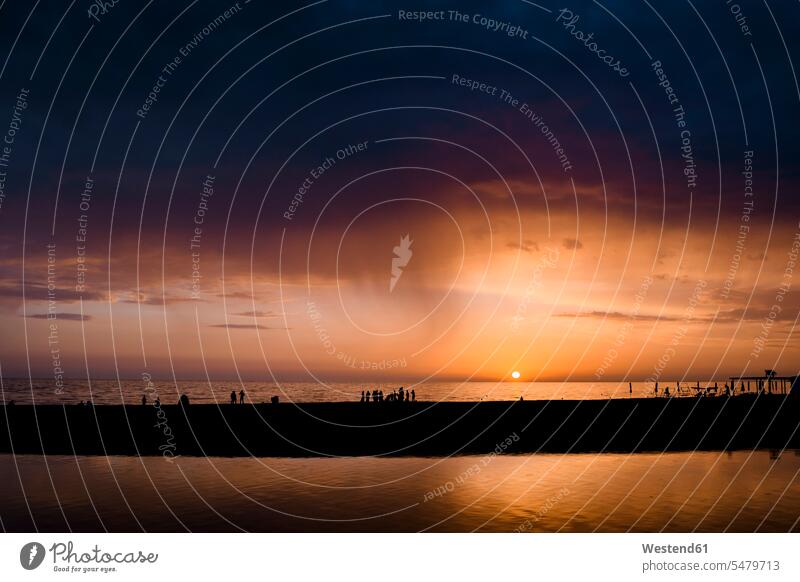 Russia, Sochi, rainfall over the sea at sunset relaxation relaxing tranquility tranquillity Calmness Tranquil Scene silhouette silhouettes Incidental people