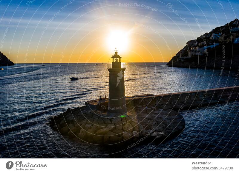 Spain, Balearic Islands, Andratx, Helicopter view of Port D Andratx Lighthouse at sunset outdoors location shots outdoor shot outdoor shots sunsets sundown