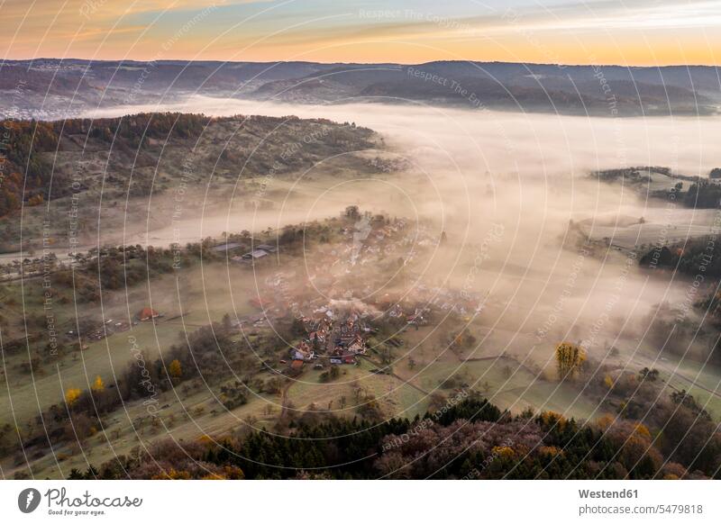 Drone view of morning fog shrouding village in Wieslauftal outdoors location shots outdoor shot outdoor shots dawn morning twilight in the morning atmosphere