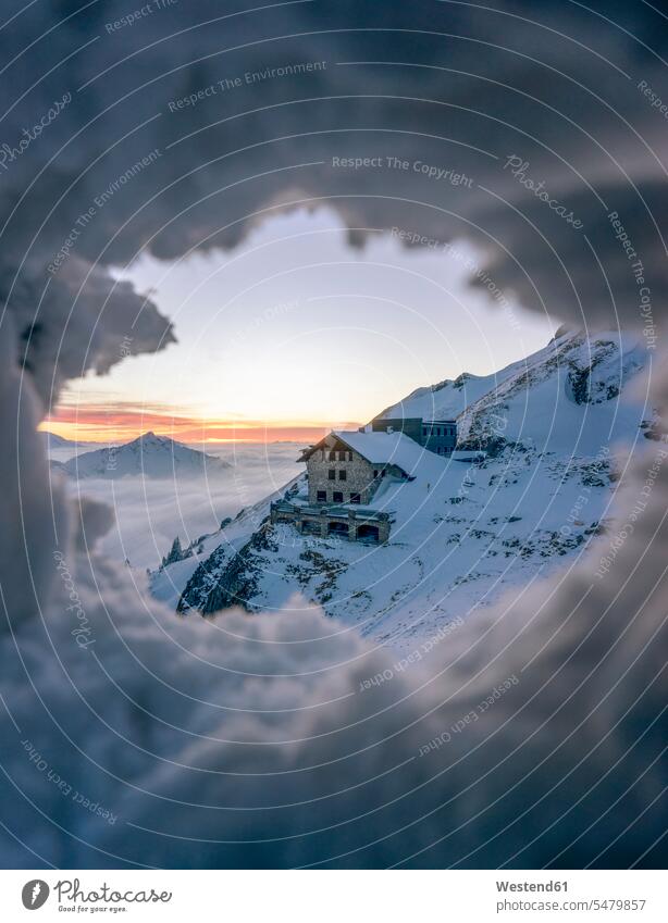 Secluded mountain hut seen through hole in snow holes rural scene Non Urban Scene Non-Urban Scene non-urban landscape landscapes scenery terrain