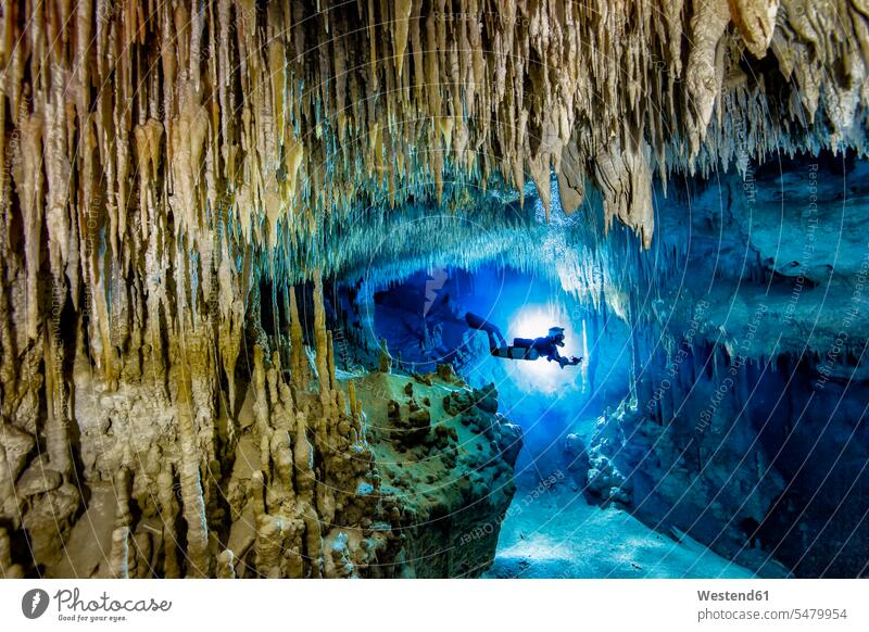 Man scuba diving in sea, Cenote Uku Cusam, Quintana Roo, Mexico color image colour image outdoors location shots outdoor shot outdoor shots Sportswear