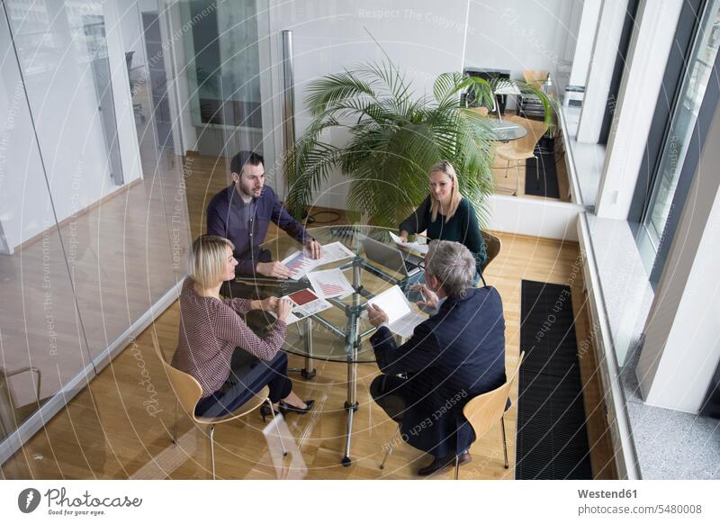 Business people having team meeting in office caucasian caucasian ethnicity caucasian appearance european Cooperation working together collaboration Cooperating