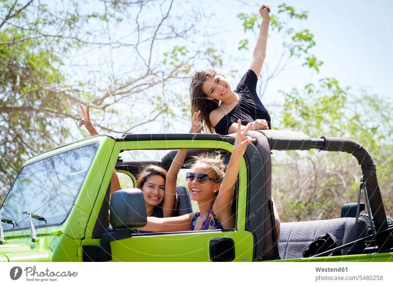 Three friends having fun in off-road vehicle female friends Teenage Girls female teenagers Fun funny mate friendship four wheel drive vehicle Four By Four car