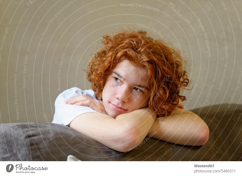 Portrait of pensive redheaded teenage boy Teenager Teens teenagers portrait portraits people persons human being humans human beings thoughtful Reflective