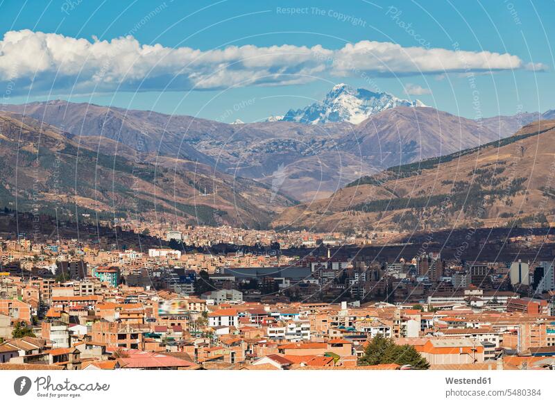 Peru, Andes, Cusco, cityscape and mountain Ausangate as seen from San Cristobal church outdoors outdoor shots location shot location shots cities metropolis