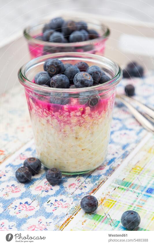 Glasses of overnight oats with blueberries and berry juice food and drink Nutrition Alimentation Food and Drinks Breakfast Berry Berries close-up close up