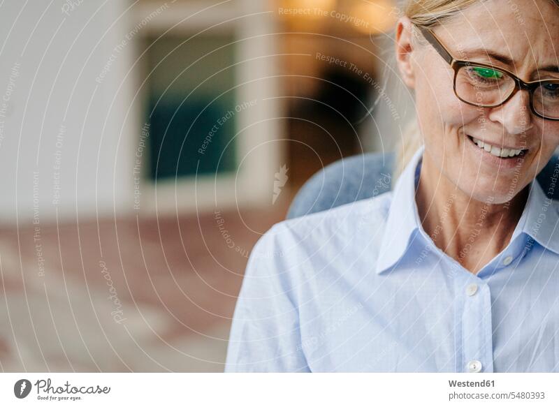 Portrait of smiling businesswoman wearing glasses businesswomen business woman business women smile business people businesspeople business world business life