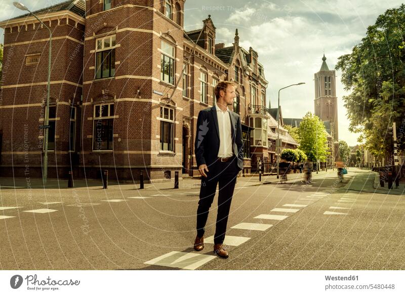 Netherlands, Venlo, businessman walking on a street city town cities towns going road streets roads Businessman Business man Businessmen Business men outdoors