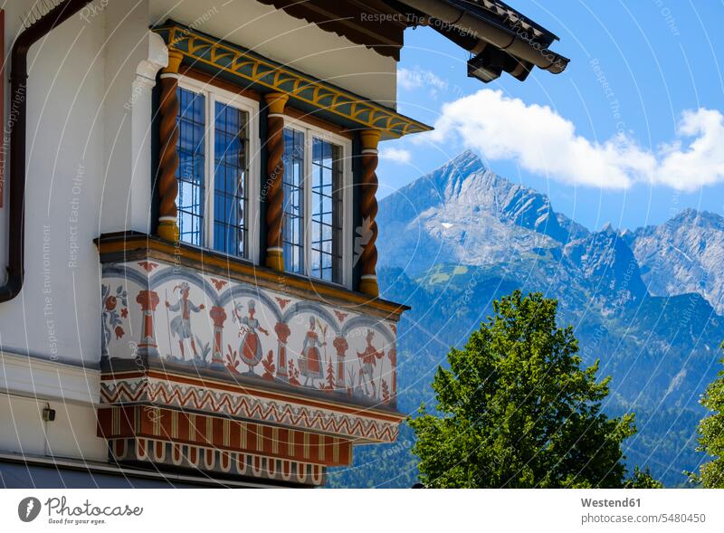 Germany, Upper Bavaria, Garmisch, Oriel of an traditional house with Alpspitz maountain in background Garmisch-Partenkirchen residential house