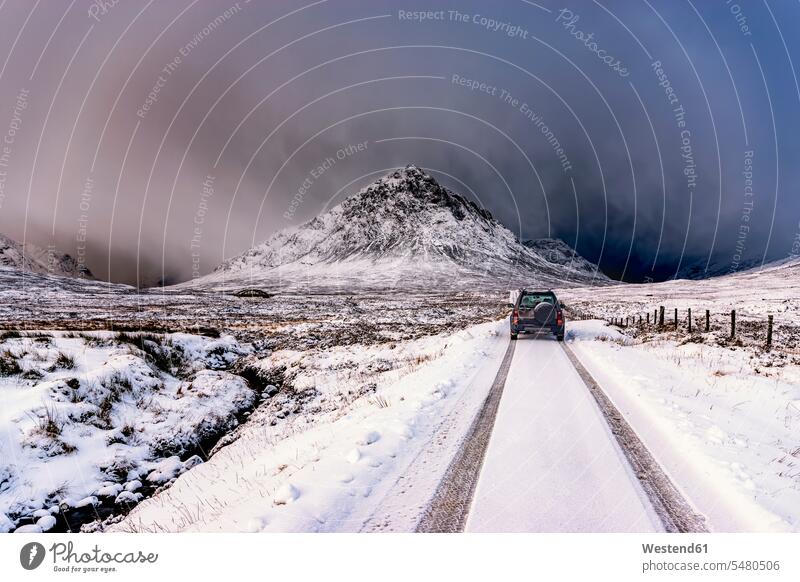 UK, Scotland, Glencoe, Buachaille Etive Mor, Four wheel drive vehicle in winter off-road vehicle scenics sceneries scenery landscape scenic view snow-covered