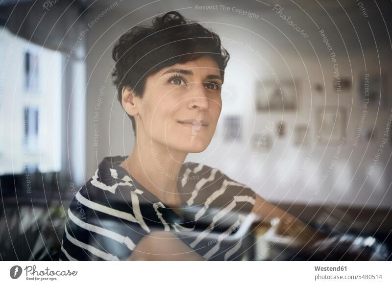 Portrait of woman at home thinking smiling smile portrait portraits females women Adults grown-ups grownups adult people persons human being humans human beings
