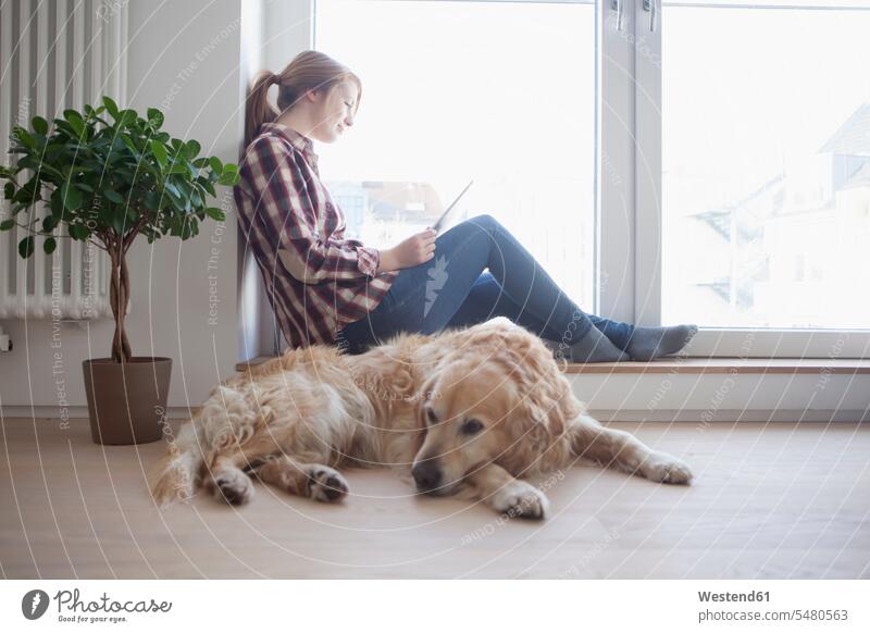 Young woman and her dog relaxing at home caucasian caucasian ethnicity caucasian appearance european potted plant potted plants pot  plants pot plant