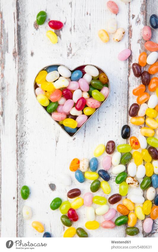 Jelly beans, heart shape on wood food and drink Nutrition Alimentation Food and Drinks scattered hearts heart shapes Love loving heart-shape love heart