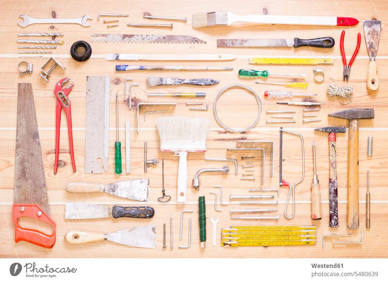 Various tools on wood collection saw saws used Things That Go Together nail tack nails brad many plenty arrangement grouping large group of objects many objects