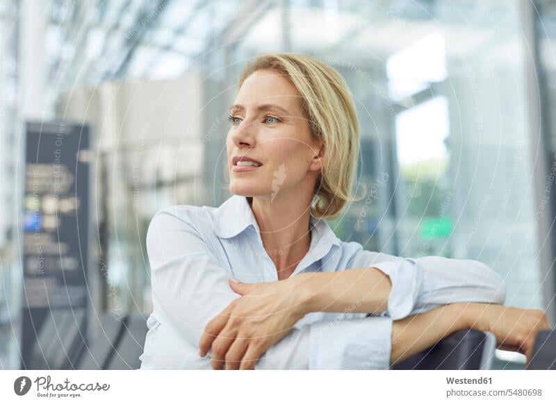 Portrait of businesswoman waiting at the airport portrait portraits airports businesswomen business woman business women business people businesspeople
