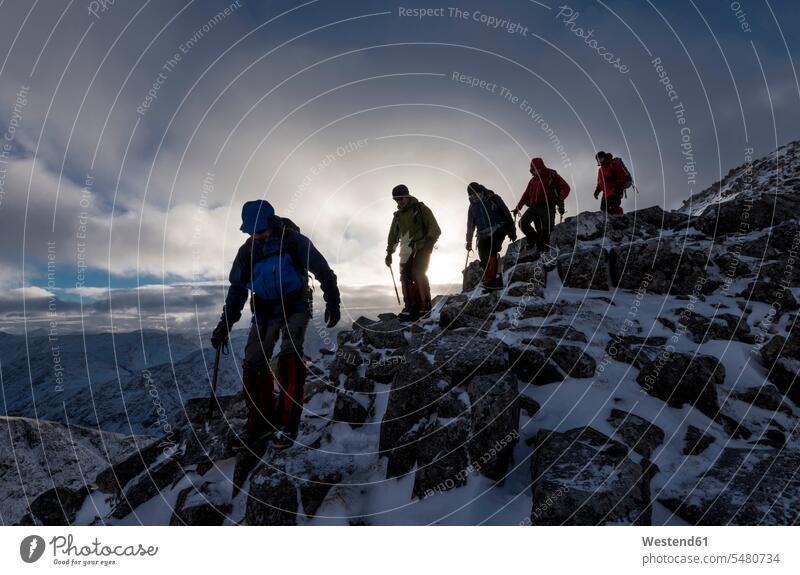 UK, Scotland, Glencoe, mountaineers at Buachaill Etive Beag winter hibernal mountaineering Climbing Mountain mountain climbing group of people Group