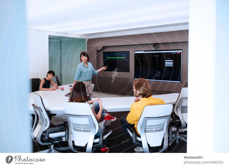 Business people having a meeting in a futuristic office the future visionary training training course Office Offices professional professionalism learning