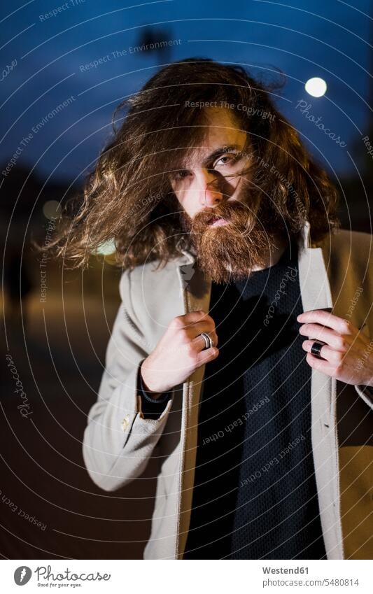 Portrait of stylish young man outdoors in the city at night men males by night nite night photography full beard Adults grown-ups grownups adult people persons