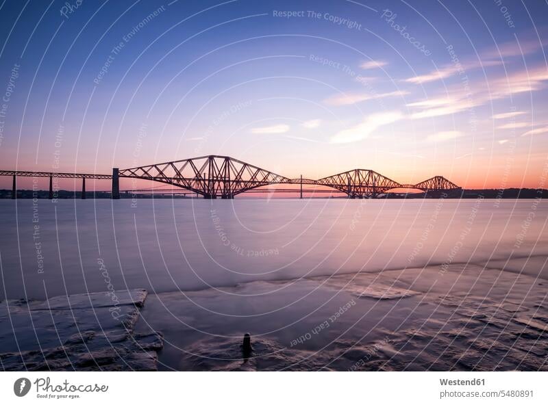 UK, Scotland, Fife, Edinburgh, Firth of Forth estuary, Forth Bridge, Forth Road Bridge and Queensferry Crossing in the background at sunset cloud clouds