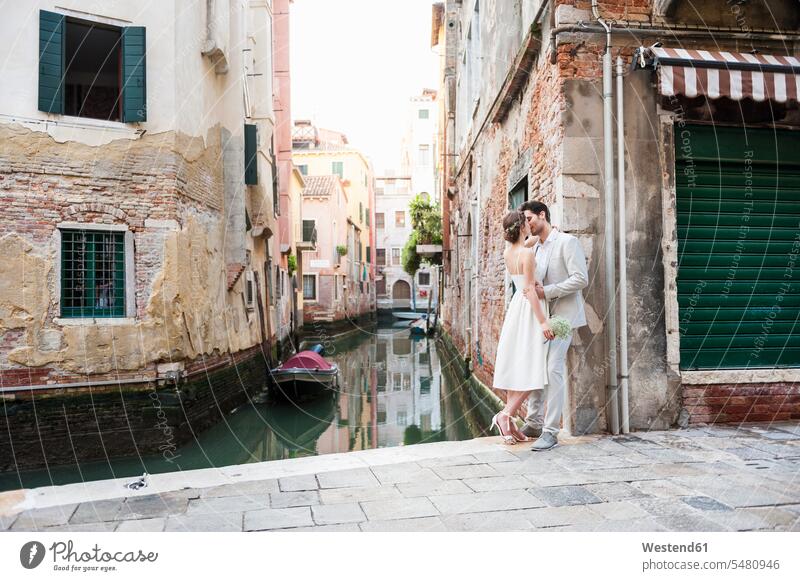 Italy, Venice, kissing bridal couple bridal couples kisses married couple married couples marriage people persons human being humans human beings happiness