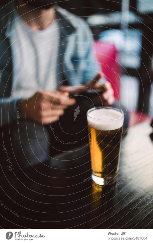 Glass of beer on table in a pub pubs tavern taverns After Work afterwork Beer Beers Ale Alcohol alcoholic beverage Alcoholic Drink Alcoholic Drinks