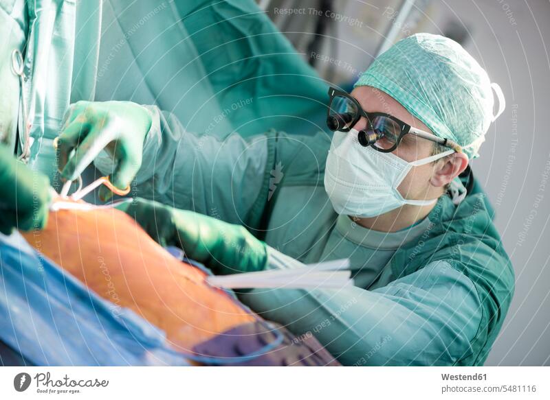 Heart surgeon during a heart operation heart surgery cardiac surgery healthcare and medicine medical Healthcare And Medicines cardiac operation Surgical