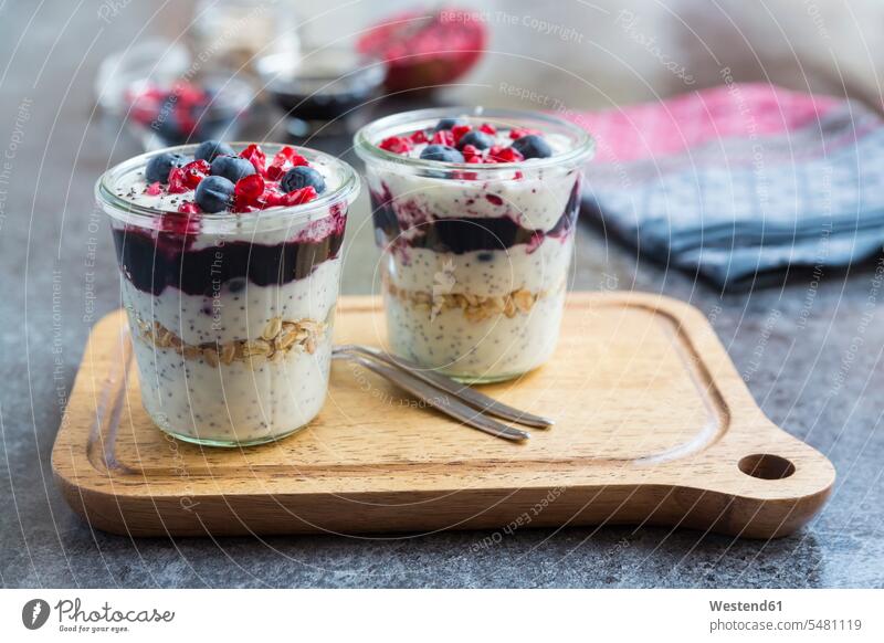 Fresh yogurt with blueberries, blueberry jam, pomegranate seeds and chia Spoon Spoons focus on foreground Focus In The Foreground focus on the foreground nobody