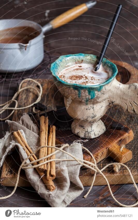 Hot cocoa with cream and cinnamon mug mugs cup ingredient ingredients garnished cinnamon stick cinnamon sticks ready to eat ready-to-eat marshmallow