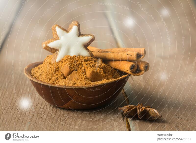 Bowl of cinnamon powder decorated with cinnamon star and cinnamon sticks Christmas Cookie Christmas Cookies Christmas Biscuits Star Anise star-anise Lens Flare