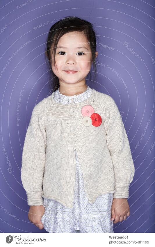 Portrait of smiling little girl wearing cardigan females girls portrait portraits child children kid kids people persons human being humans human beings smile